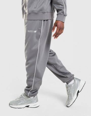 New Balance Pantalón de chándal Apres Poly (M y XL) Recogida en tienda gratis